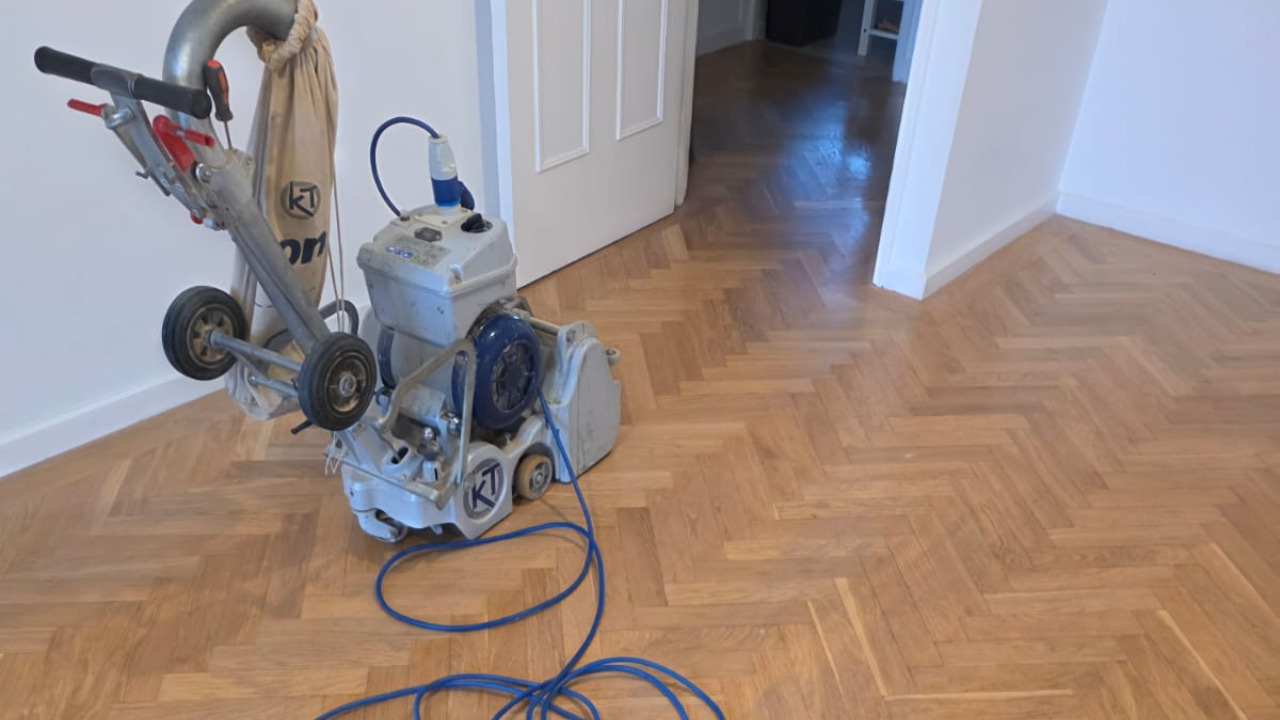 Parquet Floor Sanding in Farnborough on an oak herringbone hardwood floor using a professional sanding machine