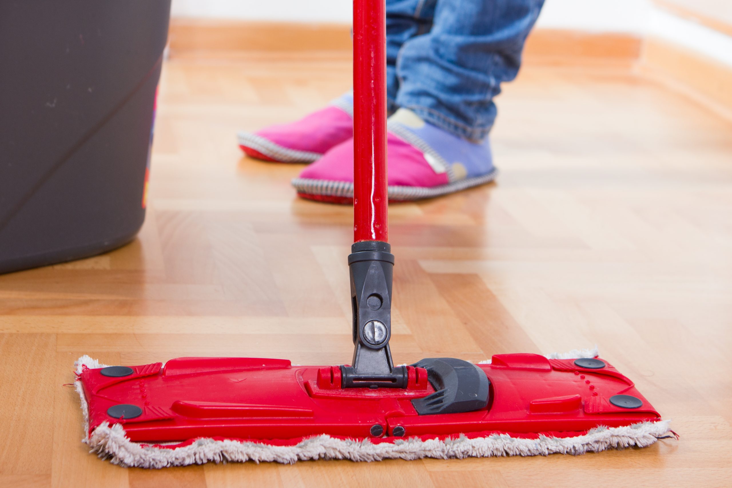 Aftercare following Parquet Floor Sanding in Farnborough on an oak parquet hardwood floor being gently cleaned with a flat mop